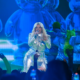 bebe rexha suffers head injury as fan throws phone at her during concert