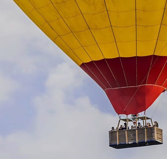 go hot air ballooning at sunrise