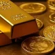 gold under pressure as strong dollar